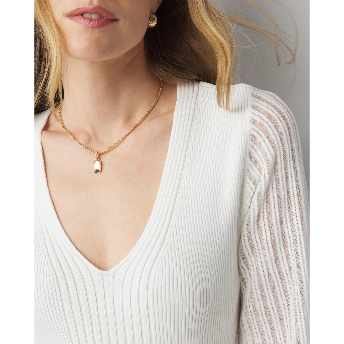 Sheer Sleeve V-Neck Sweater available now at The Falls® Sheer Sleeve V-Neck Sweater available now at The Falls®