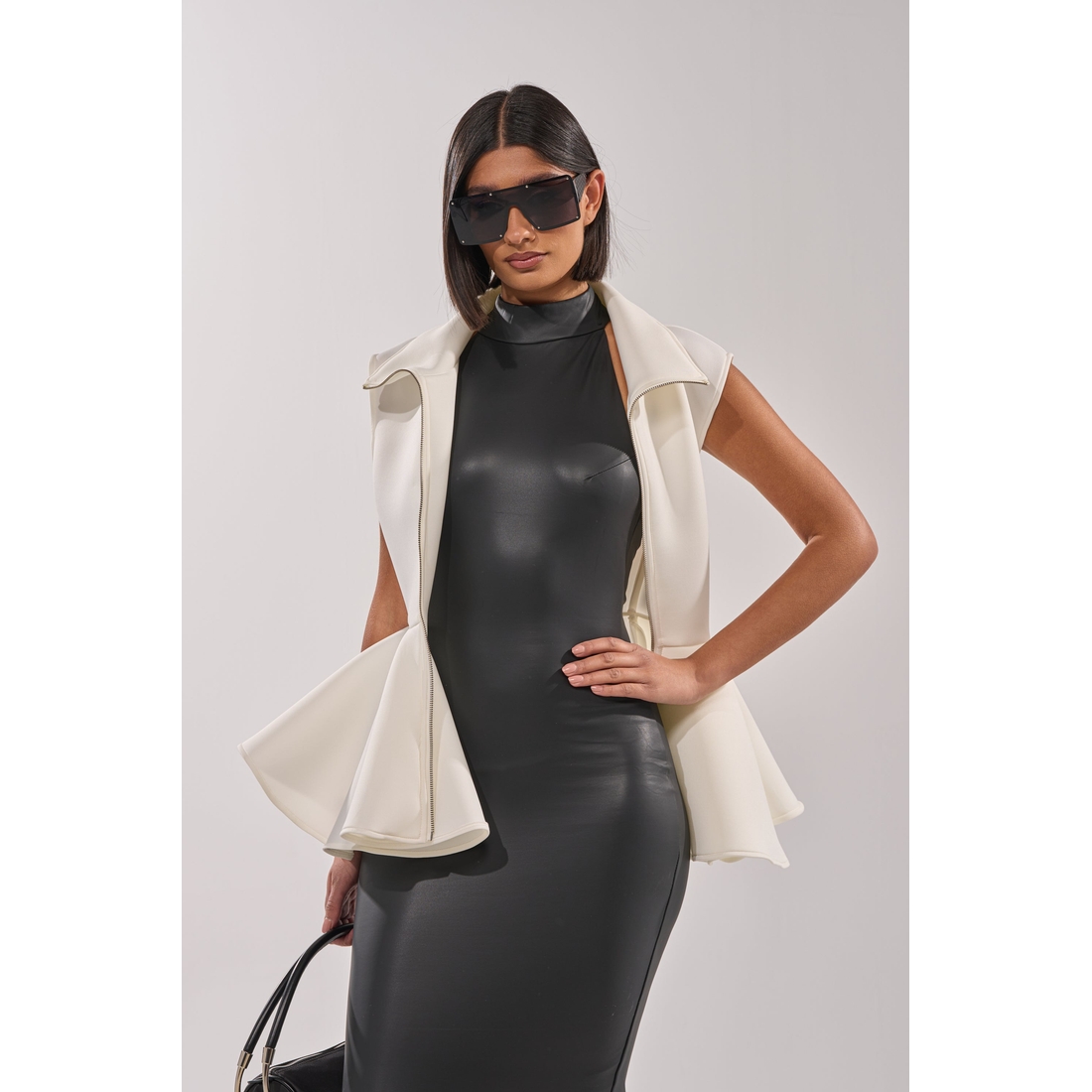 Lottie Neoprene Peplum Vest available now at Potomac Mills®