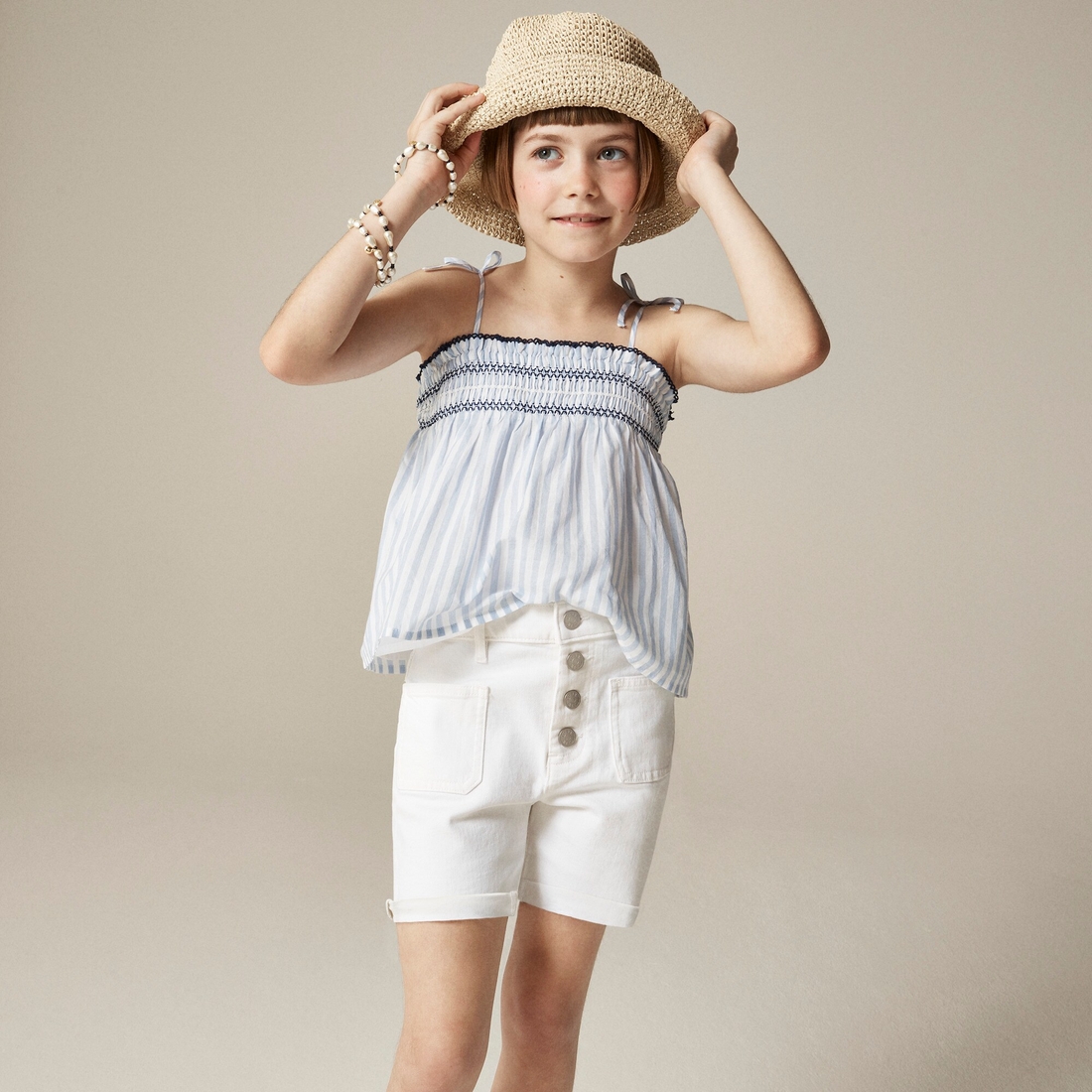 Girls' patch-pocket denim short in white available now at