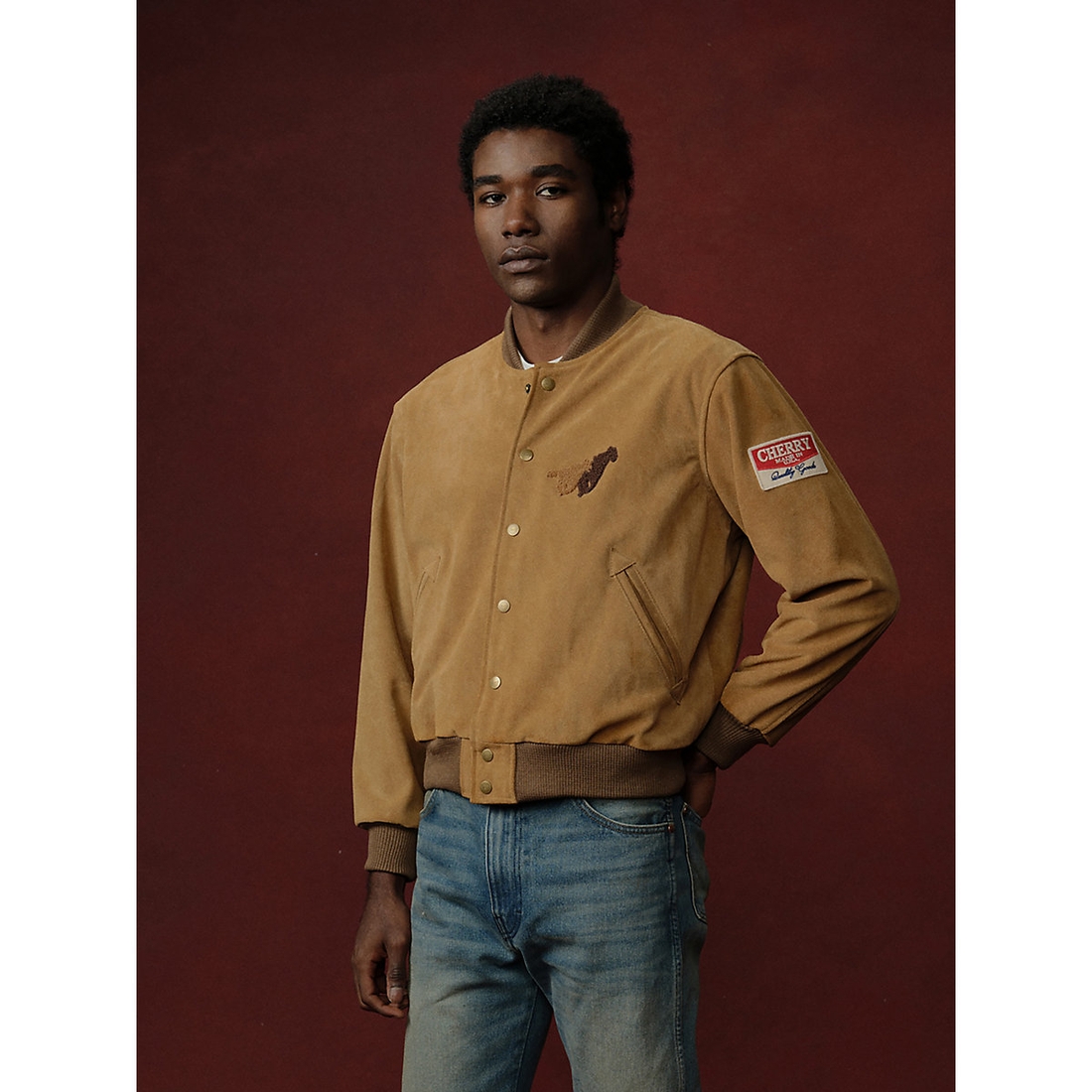 Wrangler x Cherry Suede Varsity Jacket available now at Finger